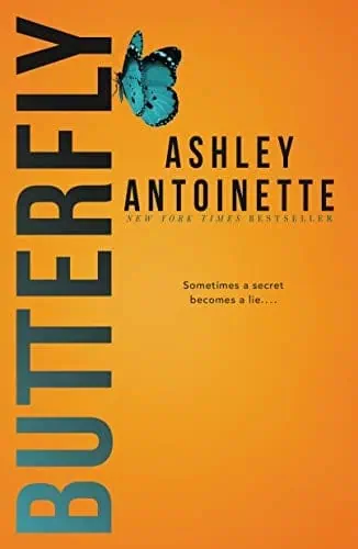 A butterfly perched on the book cover of "Butterfly" by Ashley Antoinette, featuring vibrant colors.
