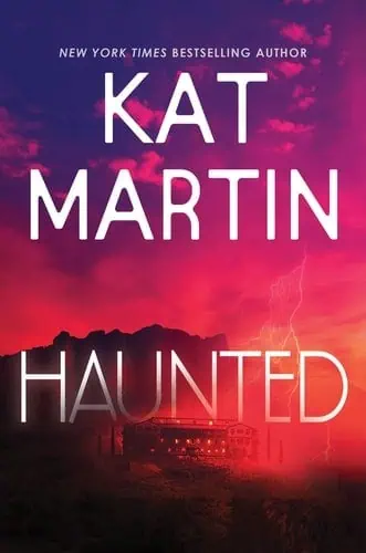 Book cover for "Haunted" by Kat Martin with stormy sky background.